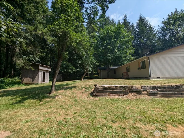 a backyard of a house with lots of green space