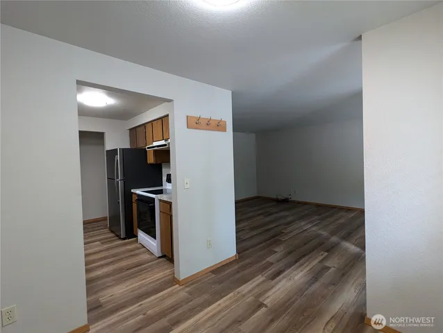a view of a kitchen from the hallway