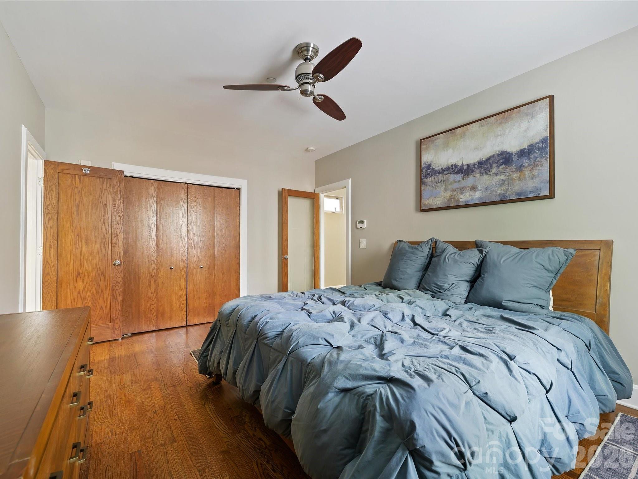 420 Queens Road Charlotte, NC 28207 - Photo 29 of 35 a bed sitting in a bedroom next to a window