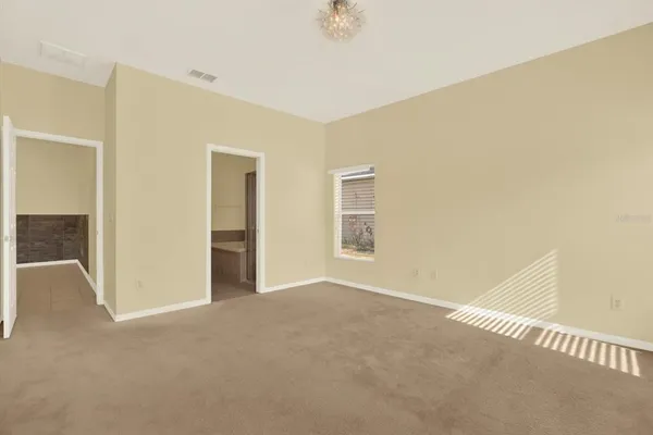 a bathroom with a granite countertop sink a toilet and a mirror