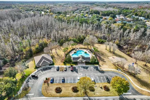 an aerial view of house with yard swimming pool and outdoor seating