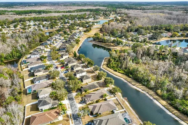 an aerial view of a house with outdoor space