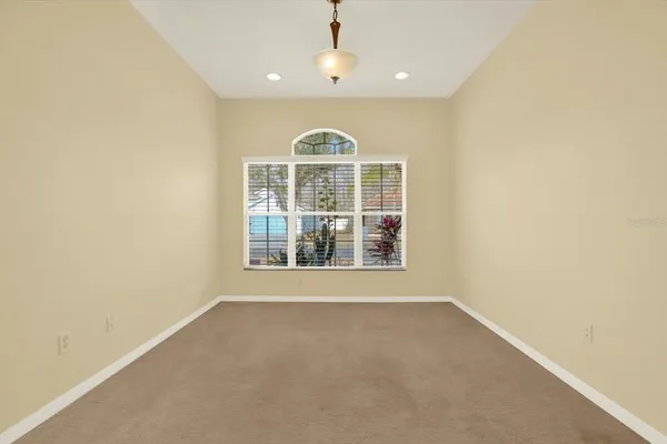 a view of livingroom with an empty space and window