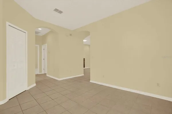 a kitchen with stainless steel appliances granite countertop a stove top oven a sink a counter top space and cabinets