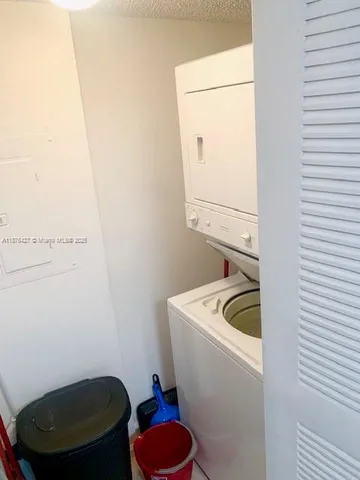 a balcony with table and chairs