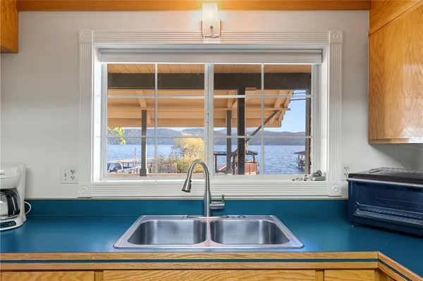 a view of a window with a sink and table
