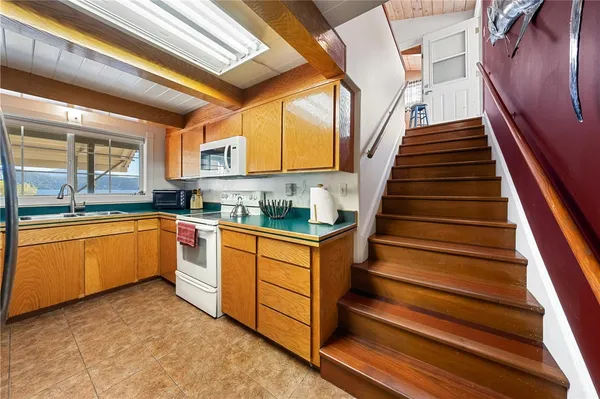 a kitchen with wooden cabinets and a sink