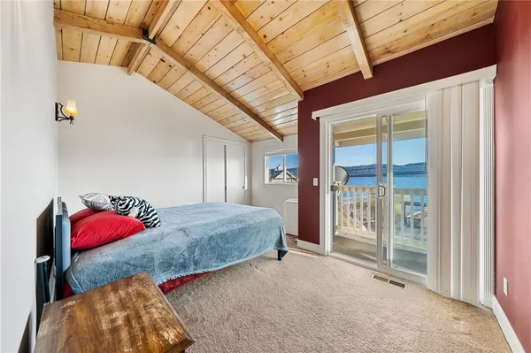 a bedroom with a bed and window