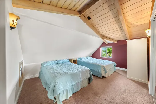 a view of bedroom with furniture and window