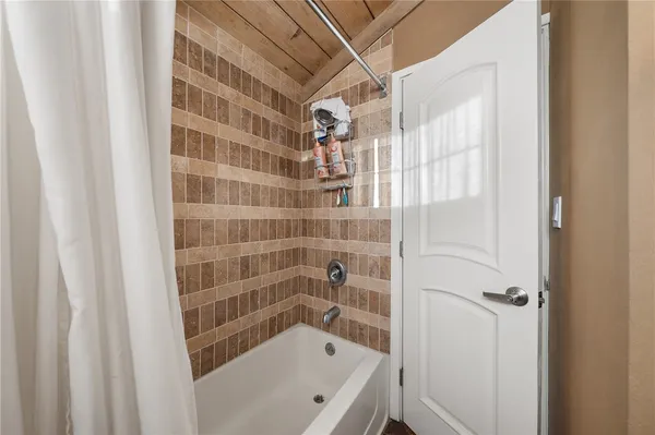 a bathroom with a bathtub