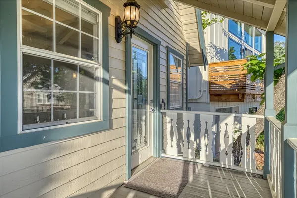 a view of front door of house with stairs