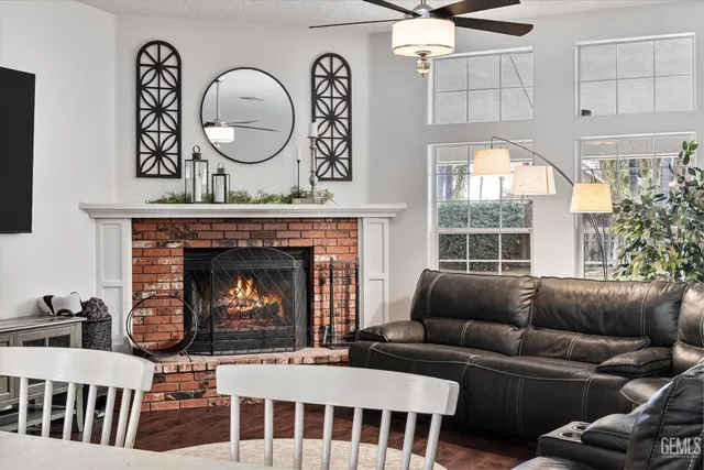 a bedroom with a bed window and a computer on the desk