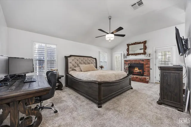 a bedroom with bed and tv