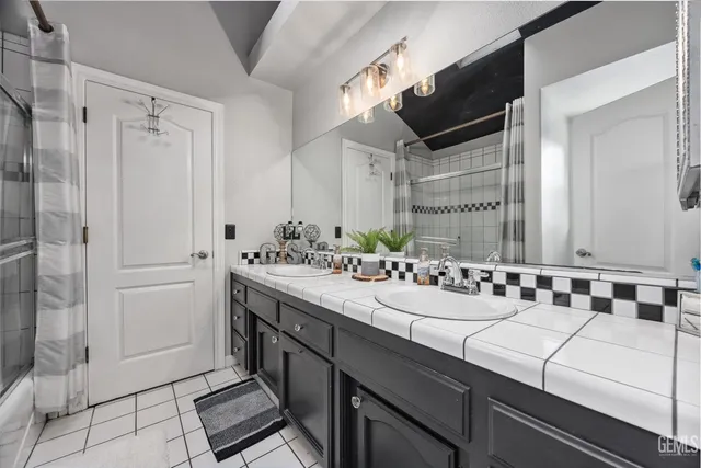 a view of a house with a big yard and palm trees