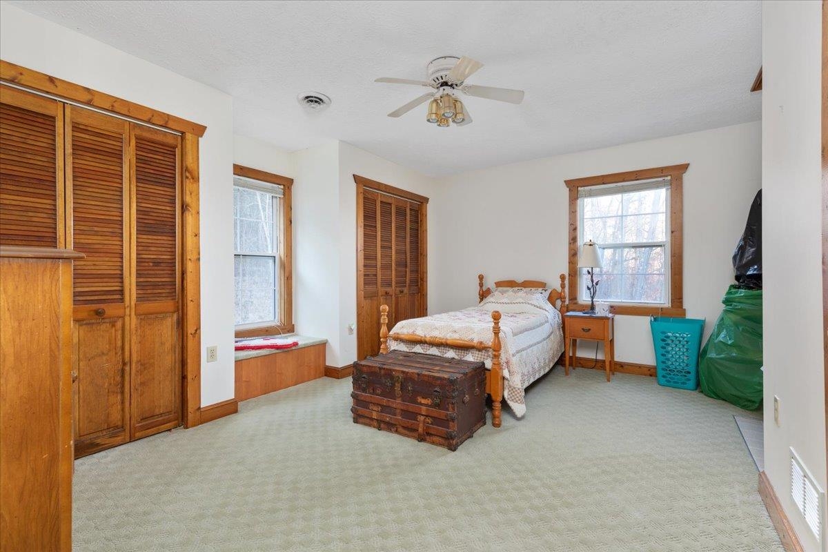 209 Park Ridge Court Front Royal, VA 22630 - Photo 26 of 59 a spacious bedroom with a bed and a chandelier