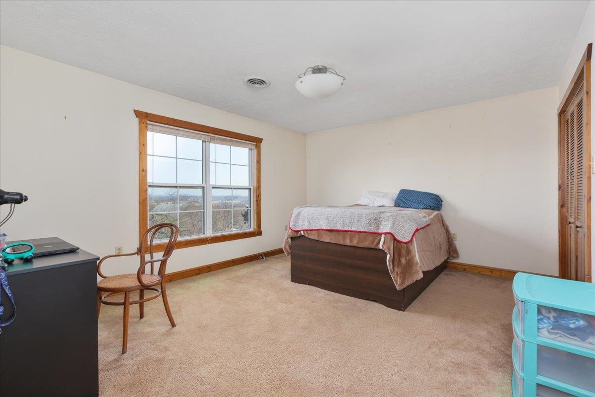 209 Park Ridge Court Front Royal, VA 22630 - Photo 30 of 59 a bedroom with a bed chair and window