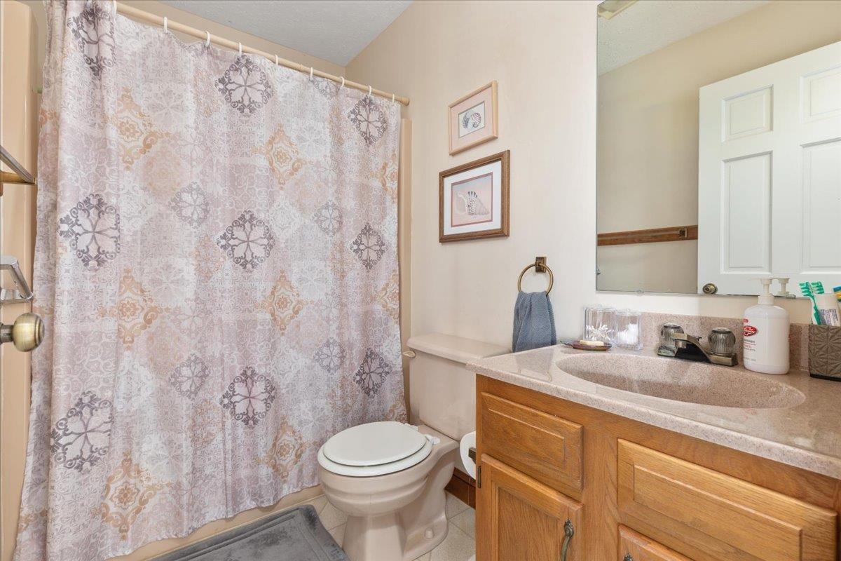 209 Park Ridge Court Front Royal, VA 22630 - Photo 31 of 59 a bathroom with a granite countertop toilet sink and mirror