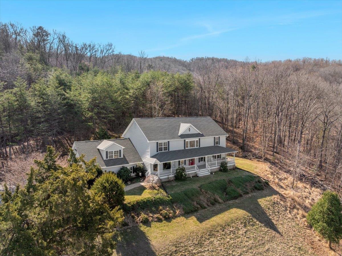 209 Park Ridge Court Front Royal, VA 22630 - Photo 50 of 59 a front view of a house with a yard and mountain view in back