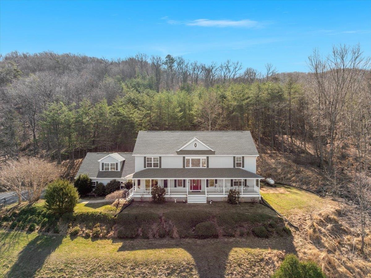 209 Park Ridge Court Front Royal, VA 22630 - Photo 51 of 59 a view of a big house with a big yard and large trees