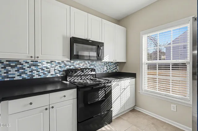 a kitchen with a stove and a sink