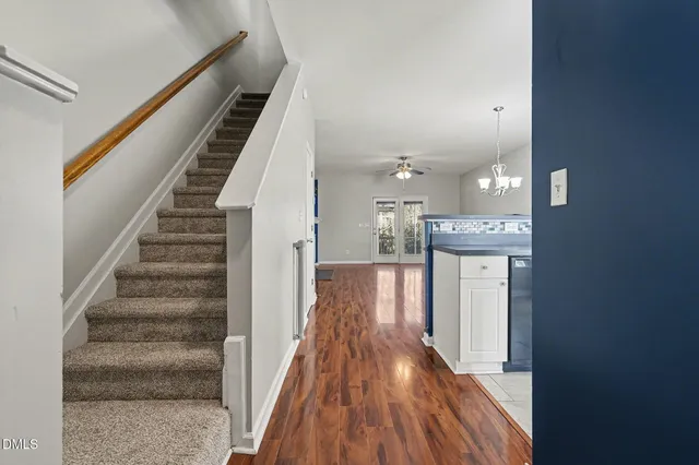 a view of front door with wooden floor
