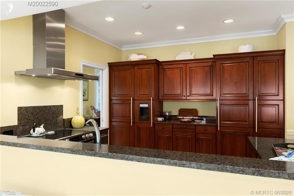 5401 Southeast Merion Way Stuart, FL 34997 - Photo 23 of 39 Customized Woodmode cabinetry installed with the handicap in mind.