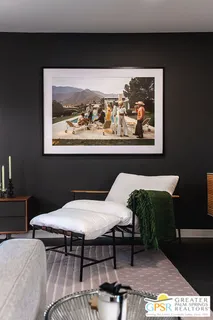 a bed sitting in a room next to a window