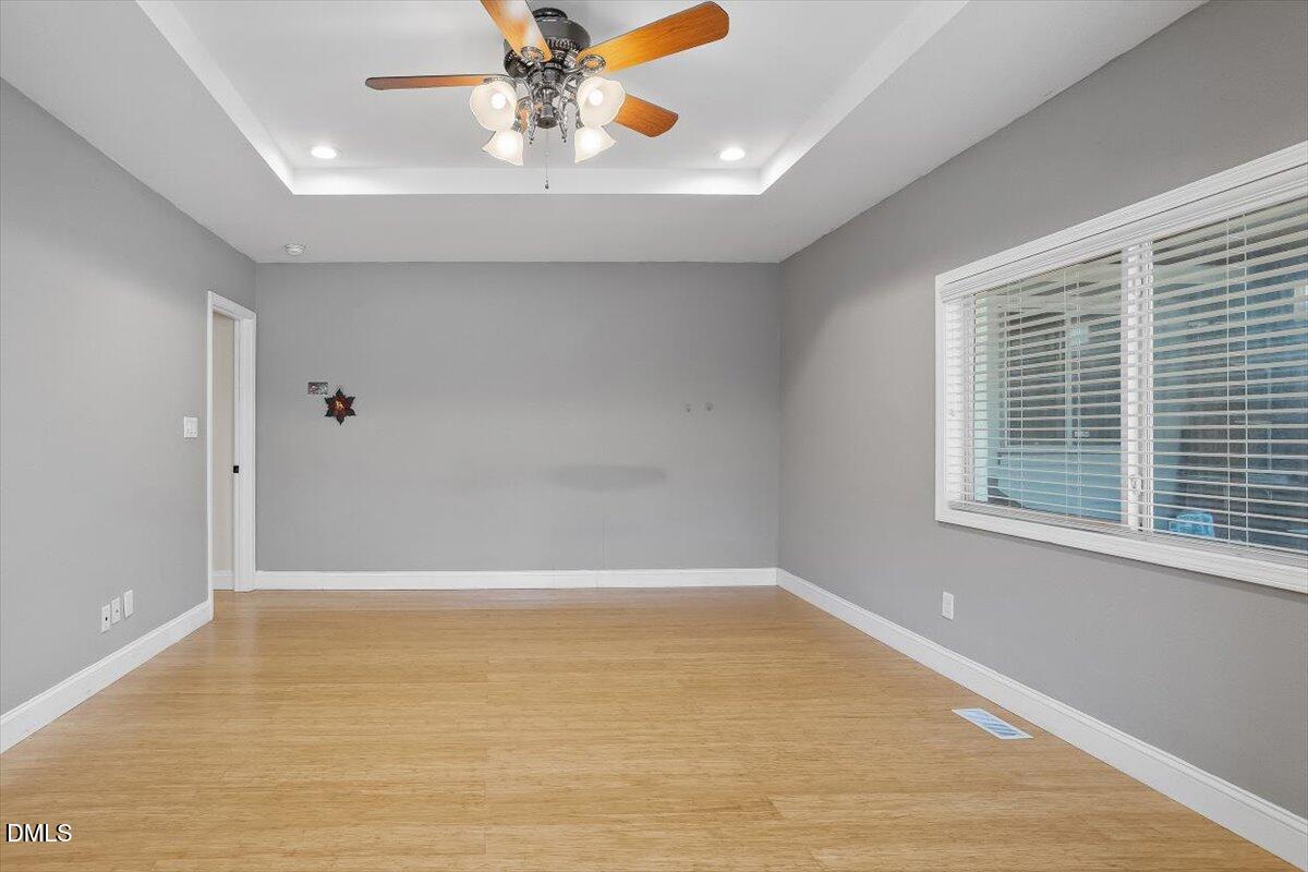 2903 Neville Road Chapel Hill, NC 27516 - Photo 20 of 47 a view of a livingroom with a ceiling fan and window