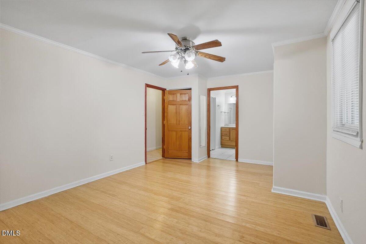 2903 Neville Road Chapel Hill, NC 27516 - Photo 23 of 47 a view of an empty room with window and wooden floor