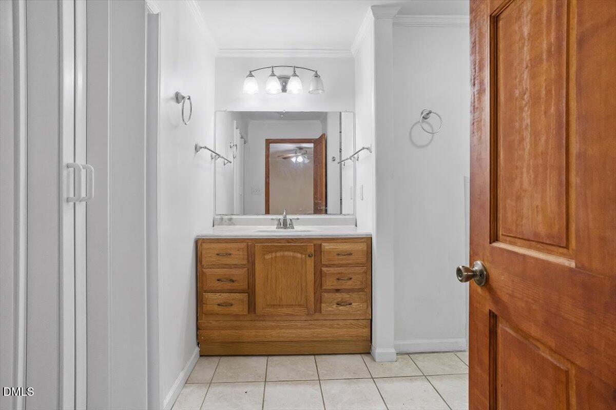 2903 Neville Road Chapel Hill, NC 27516 - Photo 24 of 47 a view of bathroom with a mirror and a sink