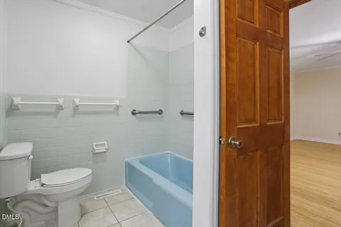 a bathroom with a toilet and shower