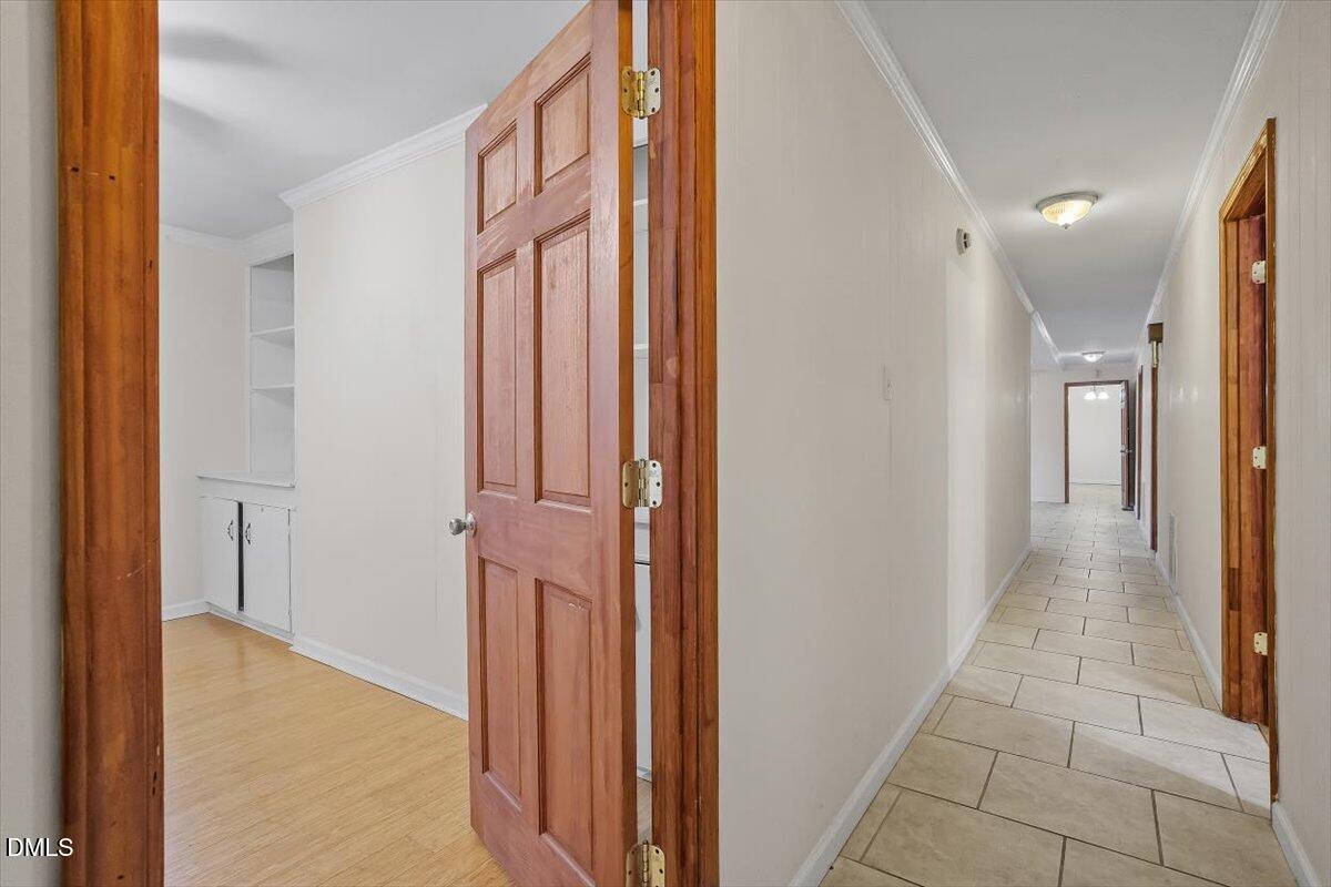 2903 Neville Road Chapel Hill, NC 27516 - Photo 27 of 47 a view of a hallway with a door and stairs