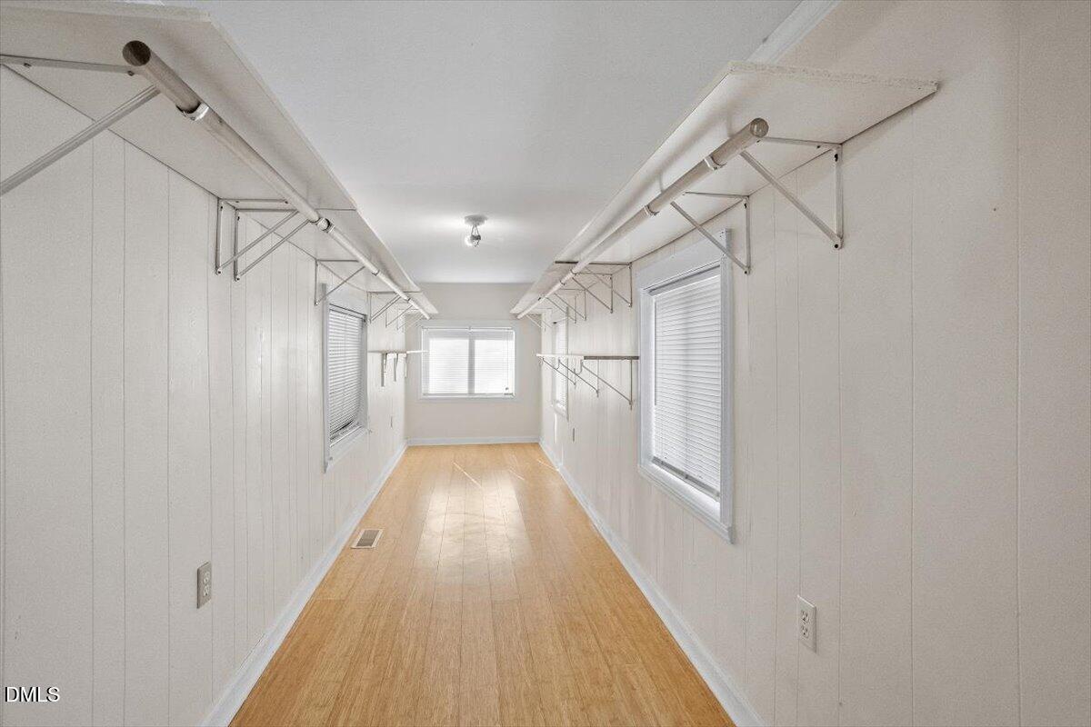 2903 Neville Road Chapel Hill, NC 27516 - Photo 30 of 47 a view of a hallway with wooden floor