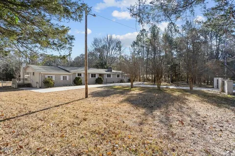 a house with trees in front of it