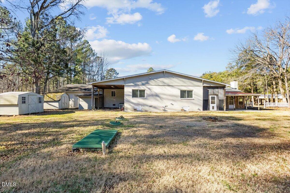 2903 Neville Road Chapel Hill, NC 27516 - Photo 36 of 47 a view of a house with backyard and a tree