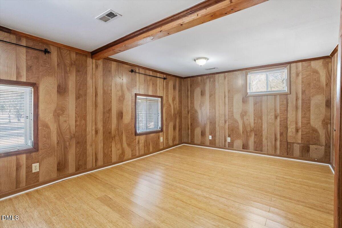 2903 Neville Road Chapel Hill, NC 27516 - Photo 44 of 47 a view of an empty room with wooden floor