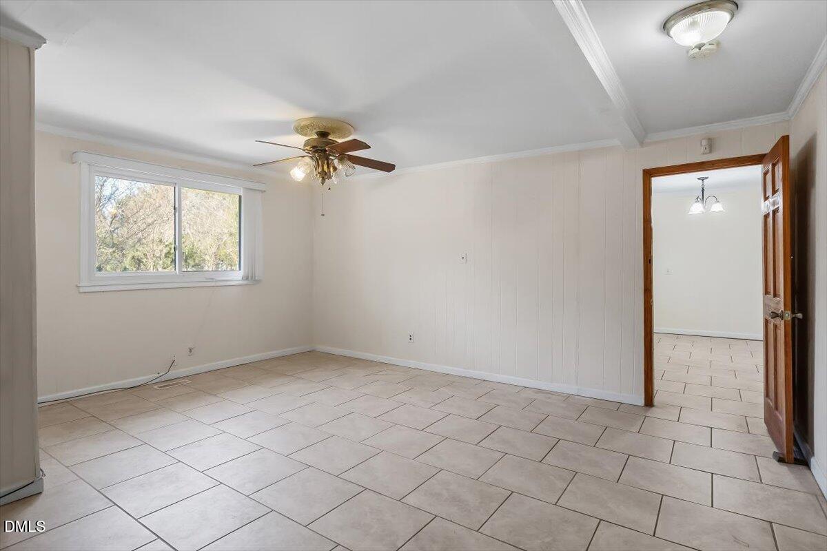 2903 Neville Road Chapel Hill, NC 27516 - Photo 7 of 47 an empty room with windows and fan