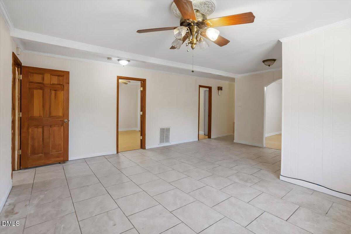 2903 Neville Road Chapel Hill, NC 27516 - Photo 8 of 47 a view of a livingroom with a chandelier fan and windows