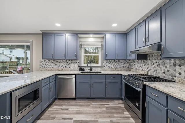 a backyard of a house with lots of green space and fountain