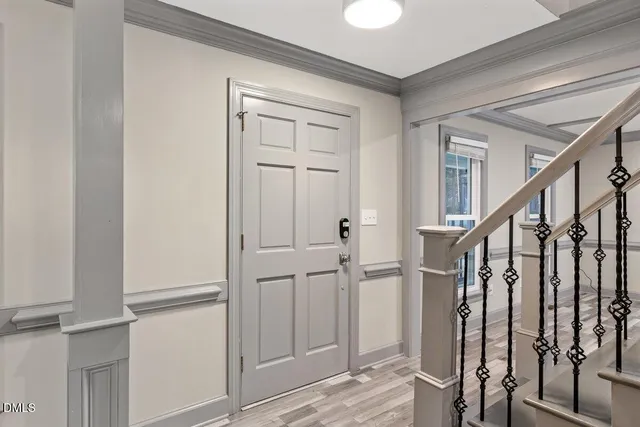 a bathroom with a granite countertop sink a toilet and a mirror