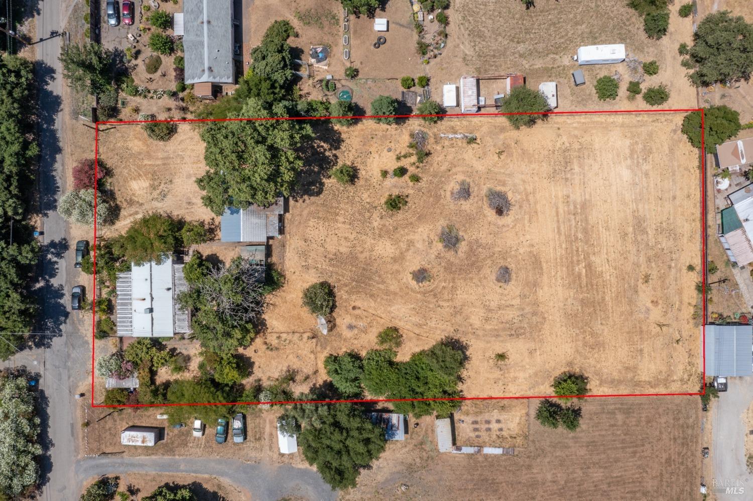 80 Hiatt Road Cloverdale, CA 95425 - Photo 1 of 1 an aerial view of a house with a yard covered with snow