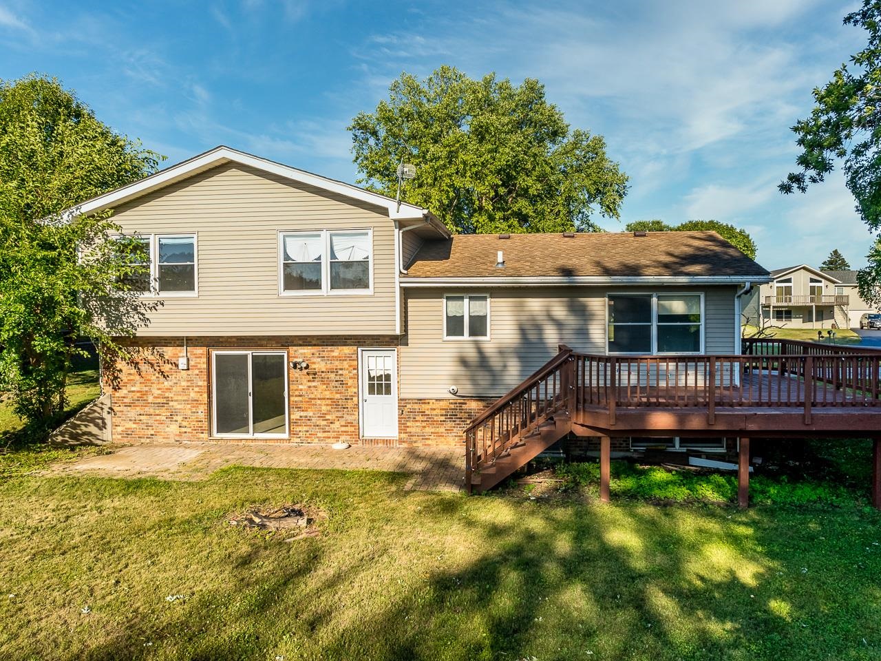 1476 Chadbourne Drive Lake Summerset, IL 61019 - Photo 22 of 22 a view of a house with a small yard and wooden fence