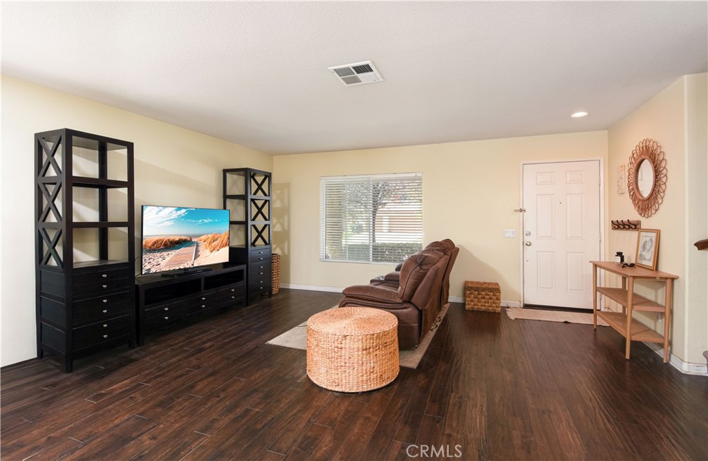 35630 Bryce Road Winchester, CA 92596 - Photo 12 of 32 a living room with furniture and a flat screen tv