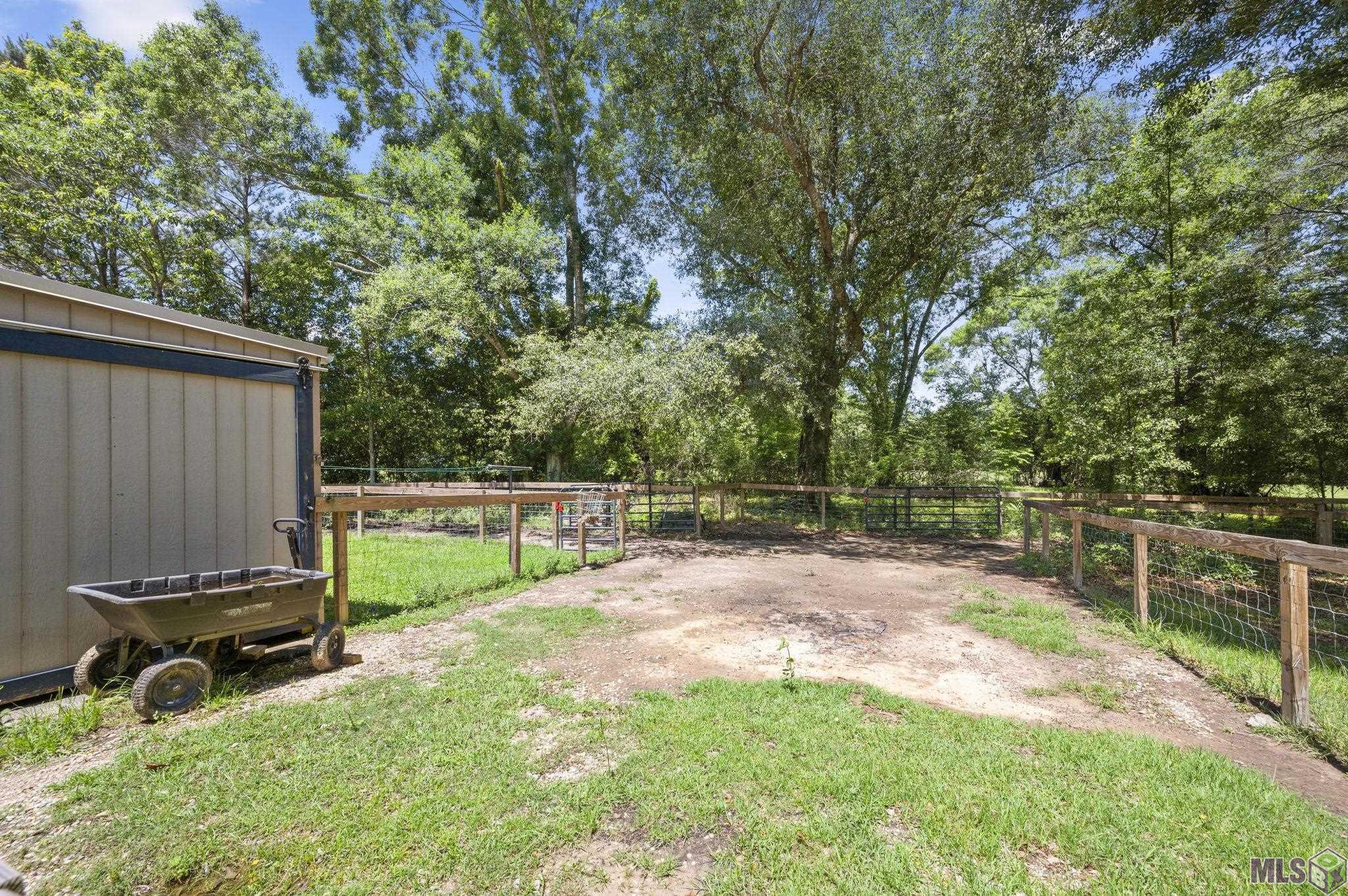 18003 Faller Road Tickfaw, LA 70466 - Photo 24 of 34 Gated side yard