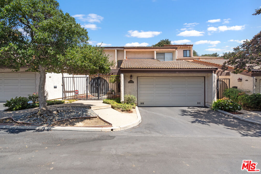 1114 Las Riendas Way Pasadena, CA 91107 - Photo 1 of 20 a front view of a house with a yard and garage