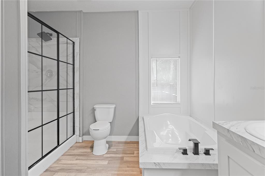 375 Sapp Street Inglis, FL 34449 - Photo 17 of 36 a bathroom with a toilet and a shower