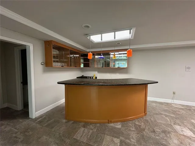 a view of kitchen with stainless steel appliances granite countertop refrigerator sink and stove