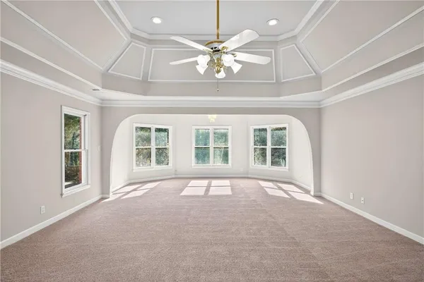 a spacious bathroom with double vanity a mirror and a bathtub
