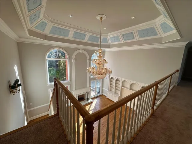 a view of entryway and hall with a front door