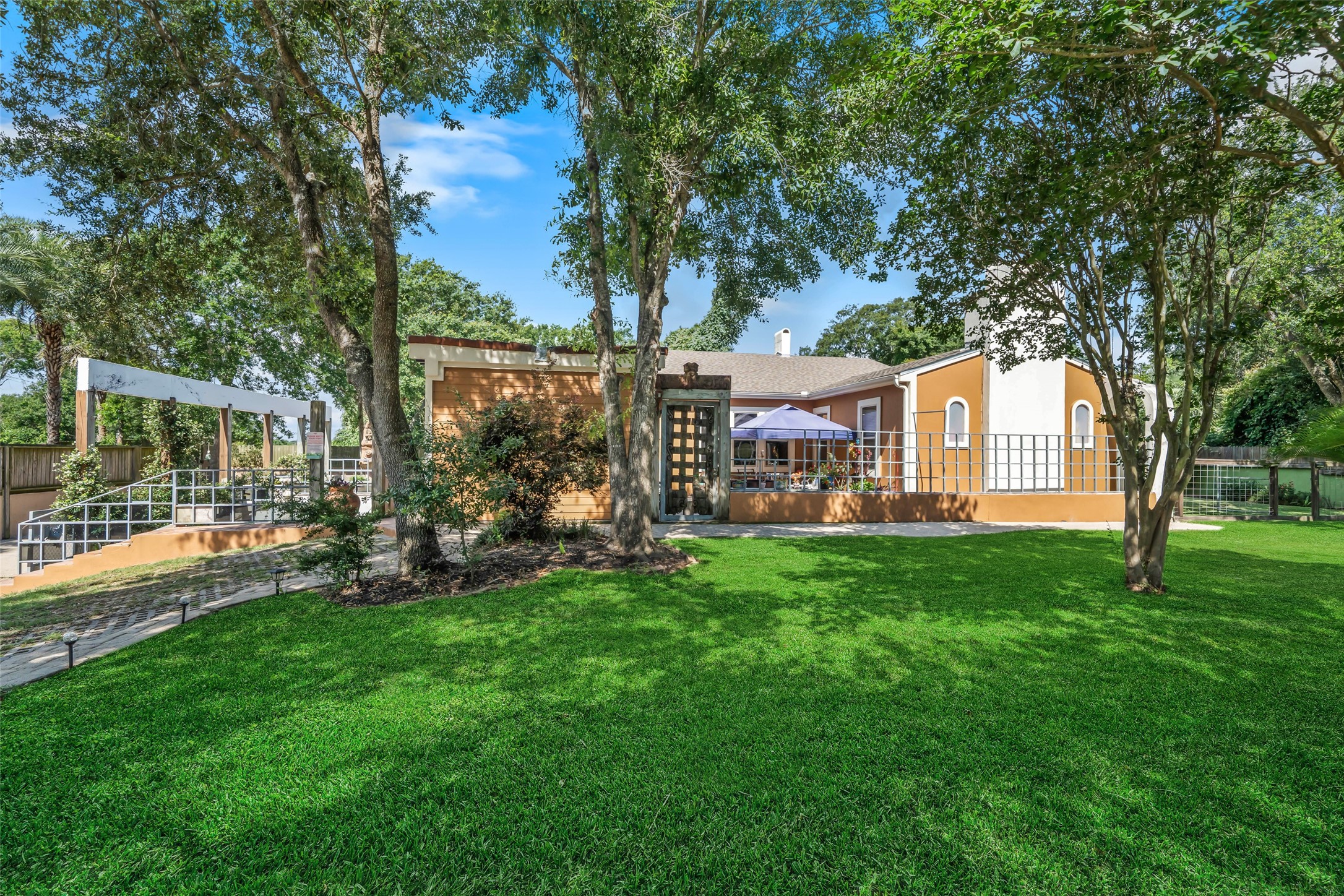 614 Pine Gully Road Seabrook, TX 77586 - Photo 37 of 49 a front view of a house with garden